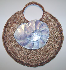 crocheted copper wire, liquid polymer clay nautilus shell purse